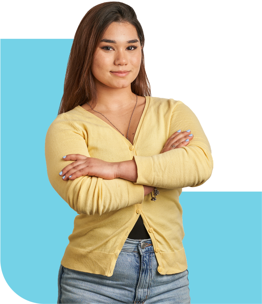 female student standing with arms crossed