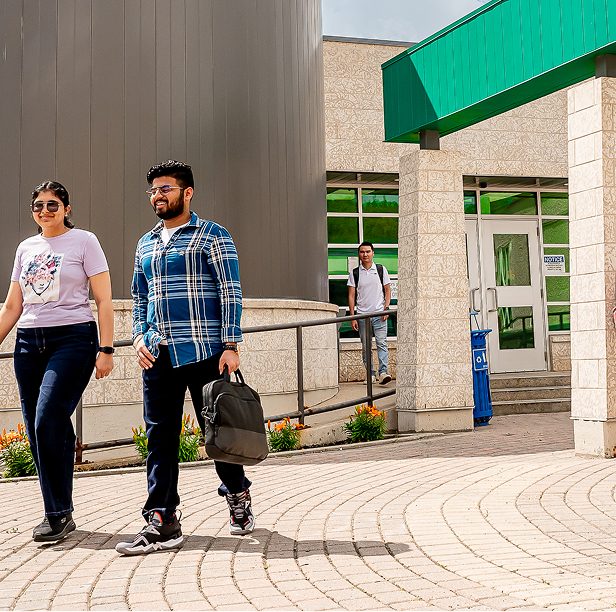 Students walking in front of campus
