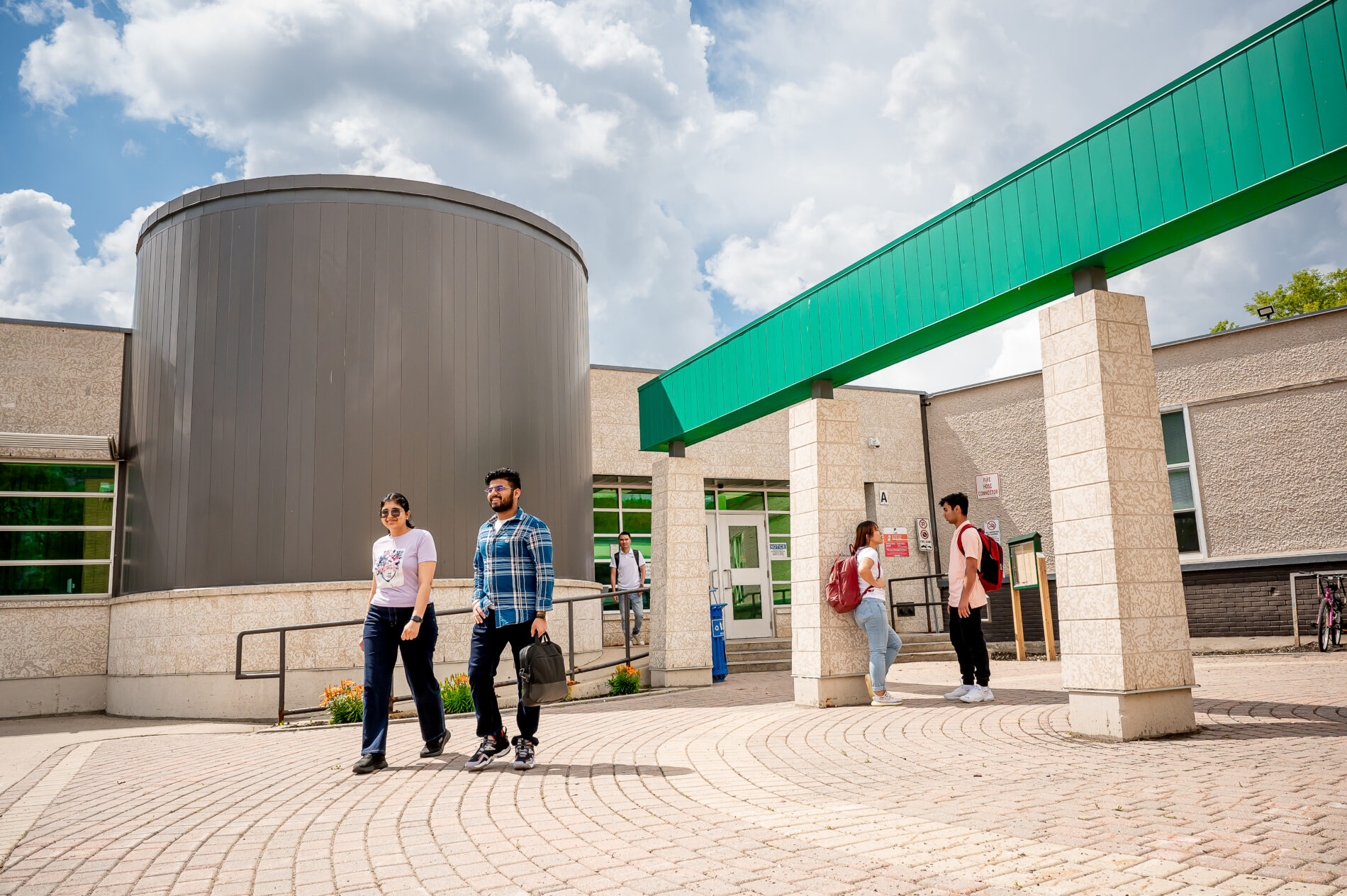 Students walking in front of campus