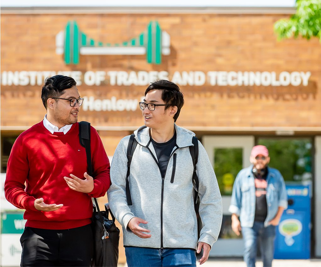 students walking in front of campus