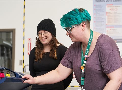 Teacher showing student something