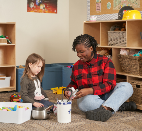 Young woman teaching a young girl