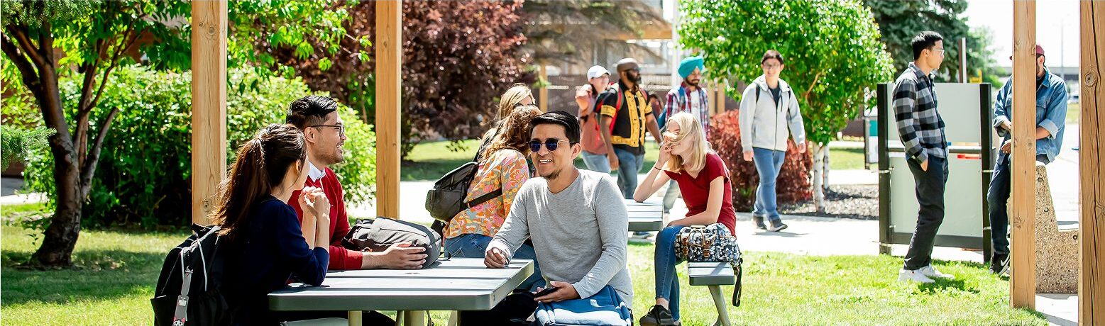 students walking on campus in different groups